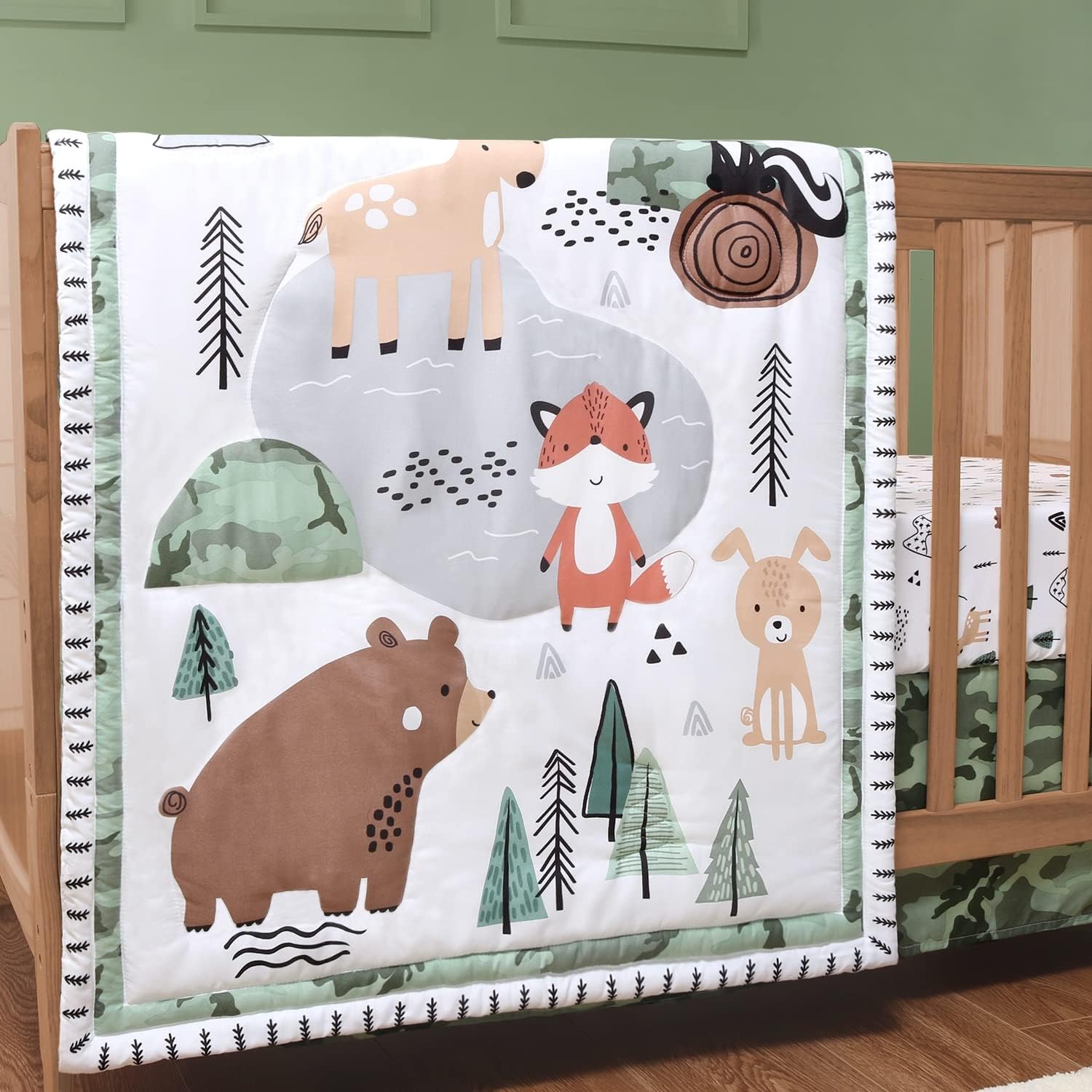 The Peanutshell woodland camo baby crib bedding set front view showcasing the embroidered quilt