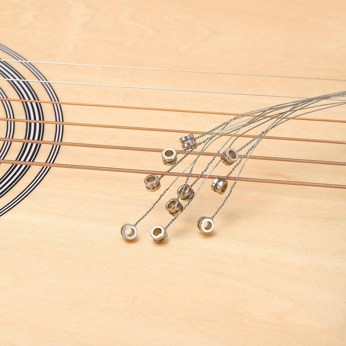 Full pack of 10 replacement guitar strings ready for installation.
