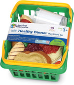 Toddler hands interacting with realistic dinner food play set items