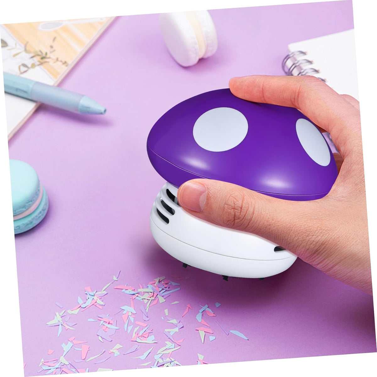 Alipis handheld crumb sweeper cleaning a computer keyboard