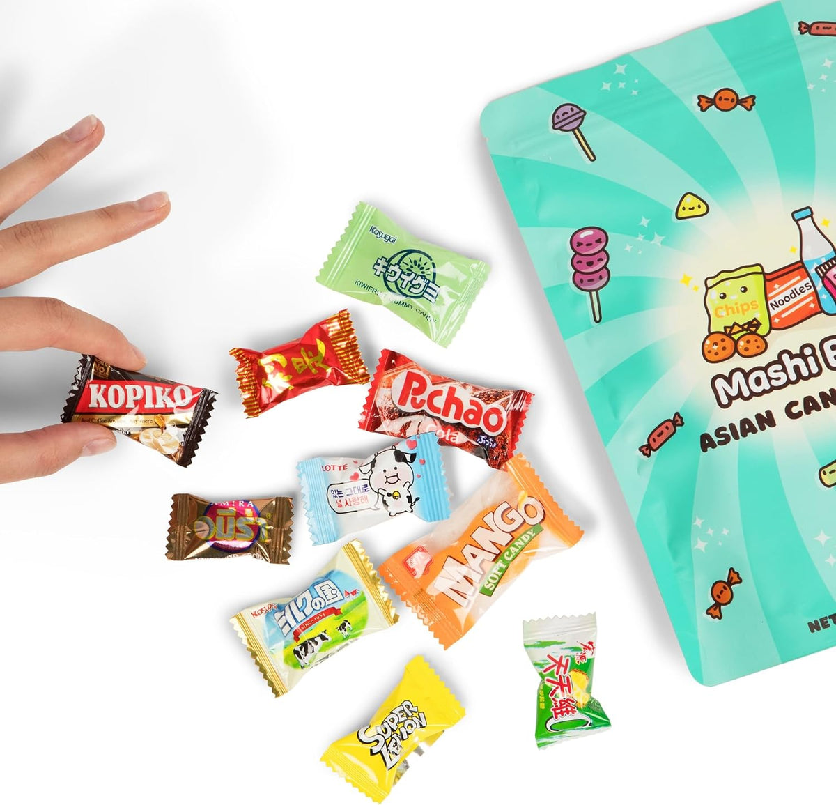 Assorted Japanese and Korean gummies and hard candies spread out from the mystery packaging.