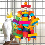 Kyouki multicolored parrot chewing toy securely hanging inside a bird cage.