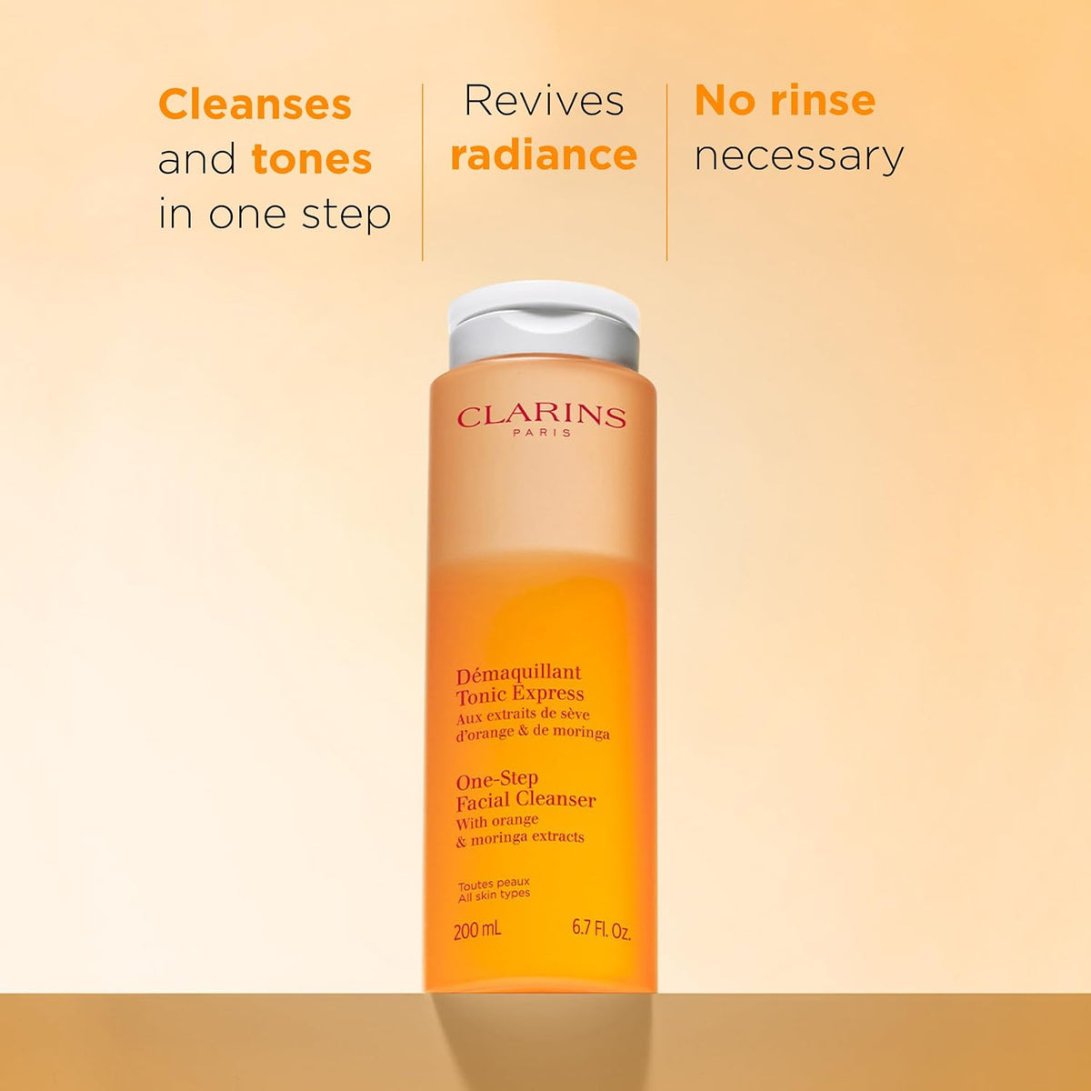 Clarins bi-phase cleanser orange gradient bottle typography