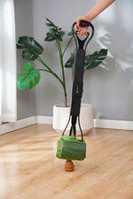 Mr. Peanut's pet waste picker highlighting the durable double spring jaw clamp mechanism.