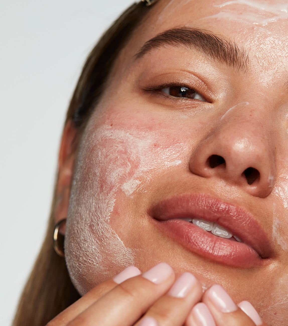 Texture shot of the creamy non foaming goat milk cleanser and lightweight peptide serum
