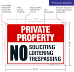 Close-up of no soliciting and no trespassing lettering on aluminum board