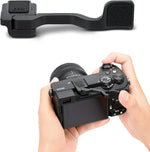 JJC Foldable Thumb Up Grip for Sony A6700 camera front view showing the premium black aluminum alloy finish.