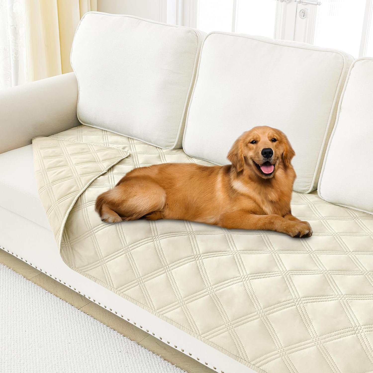 Smiry waterproof dog bed cover blanket front view showing the beige quilted texture spread over a living room sofa.