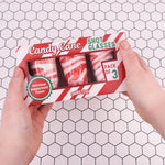 Sweetzo edible peppermint spoons dipping into a cup of hot chocolate