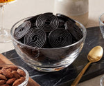 DM Sweets Black Licorice Wheels Candy packaging details showing the authentic imported ingredients list.