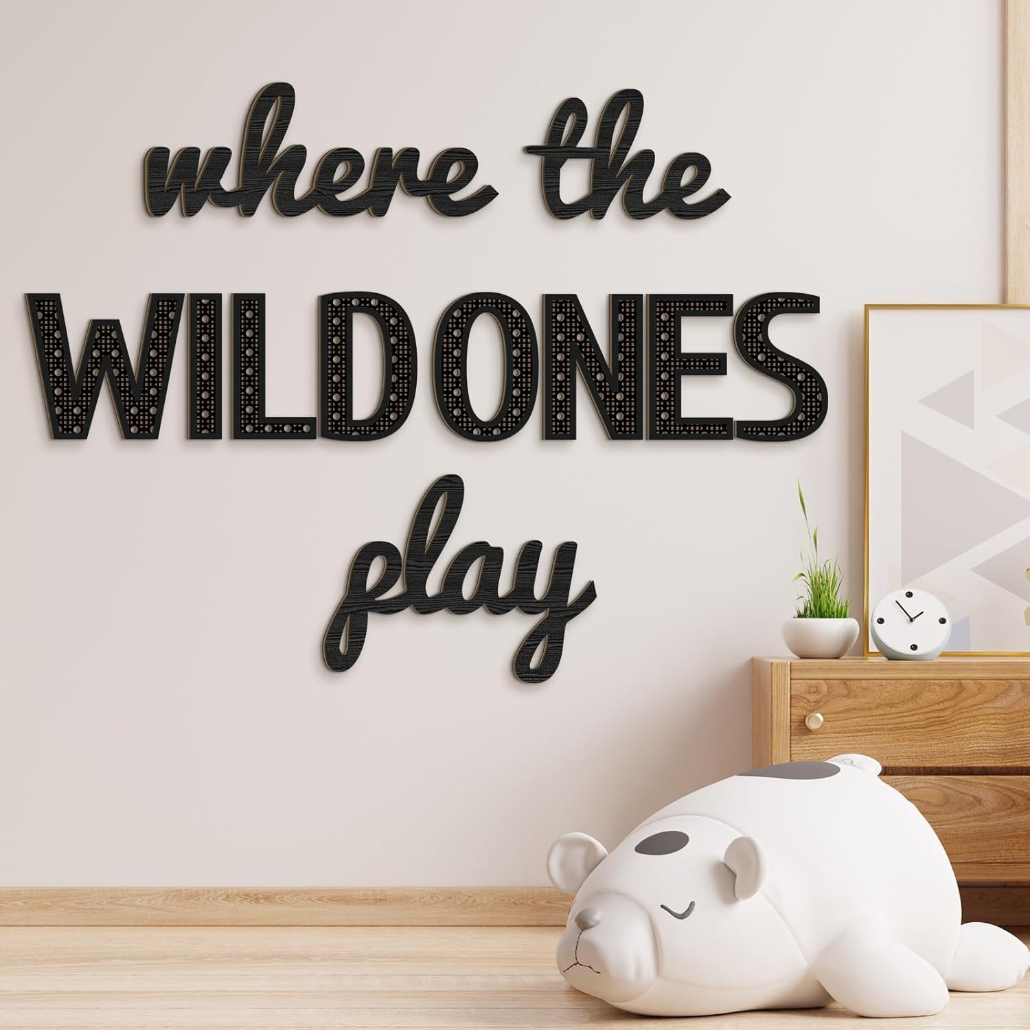 Beeveer Where the Wild Ones Play nursery sign front view in a modern kids playroom.