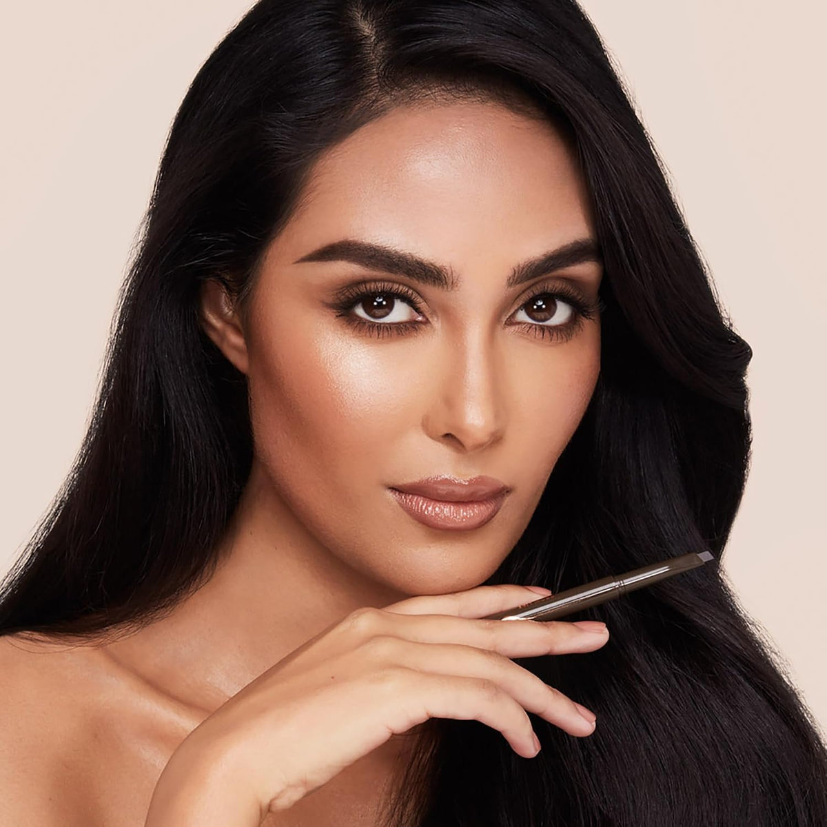 Swatches of Charlotte Tilbury Brow Cheat shades on skin