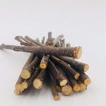 Natural apple wood dental molar sticks for rabbits and guinea pigs showcasing varying branch thicknesses