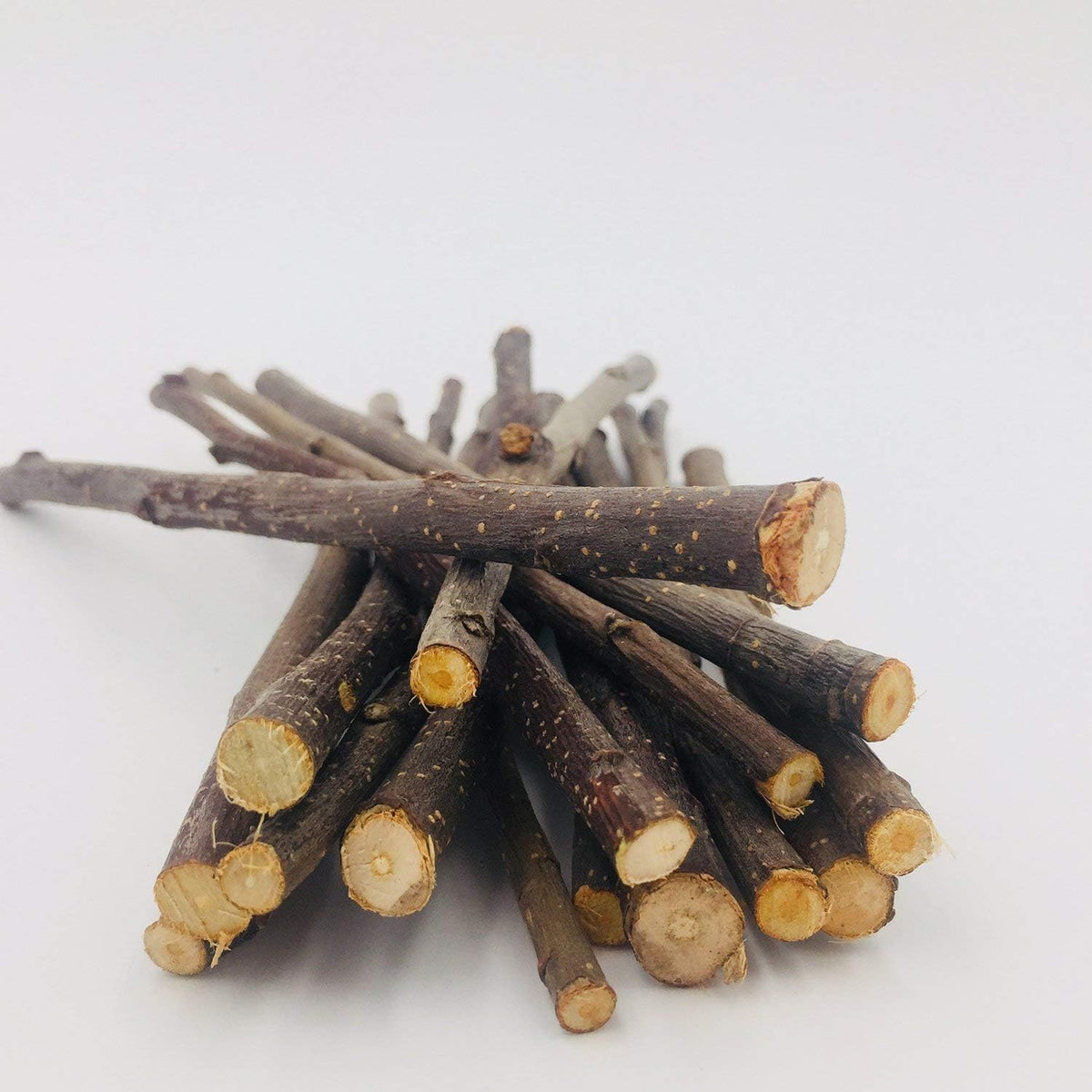 Natural apple wood dental molar sticks for rabbits and guinea pigs showcasing varying branch thicknesses