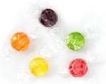 Assorted fruit hard candy pile showing flavor varieties
