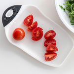 Compact cutting board showing funnel edge
