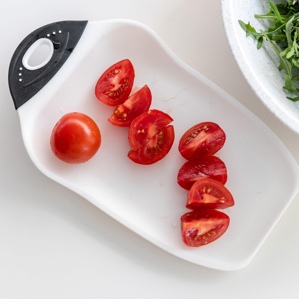 Compact cutting board showing funnel edge