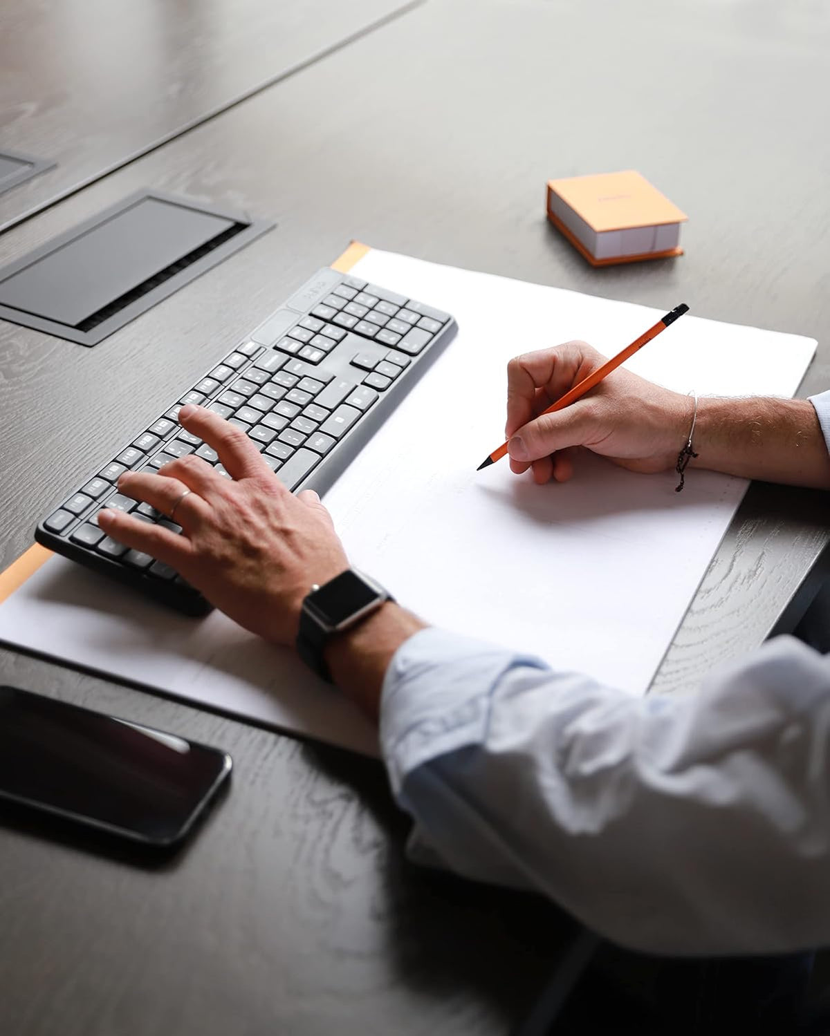 Rhodia time management planner with keyboard and mouse holder setup
