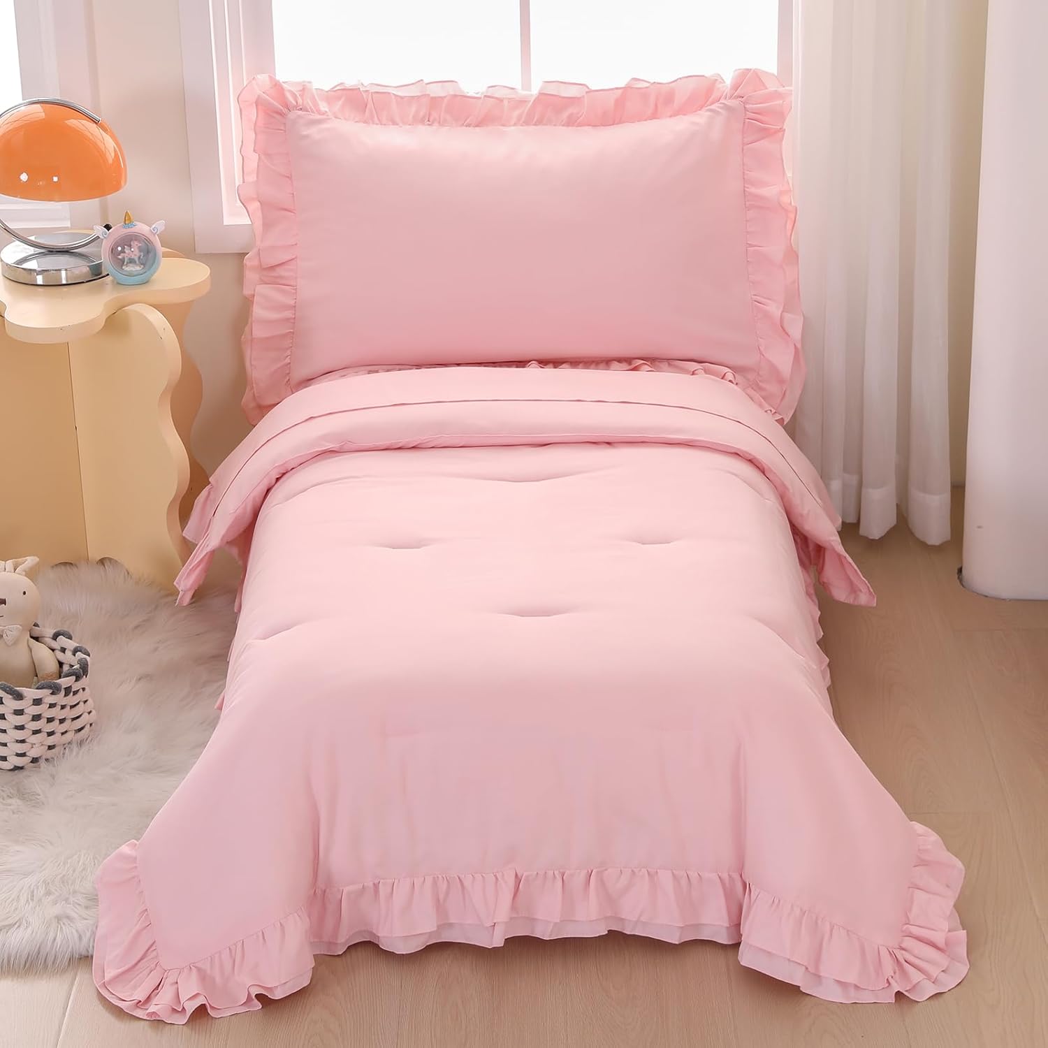 Wowelife pink toddler bedding set front view of the boho tufted comforter on a bed