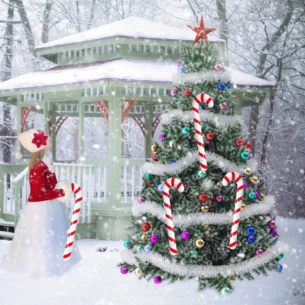 Durable PVC inflatable candy canes set up near a decorated fireplace