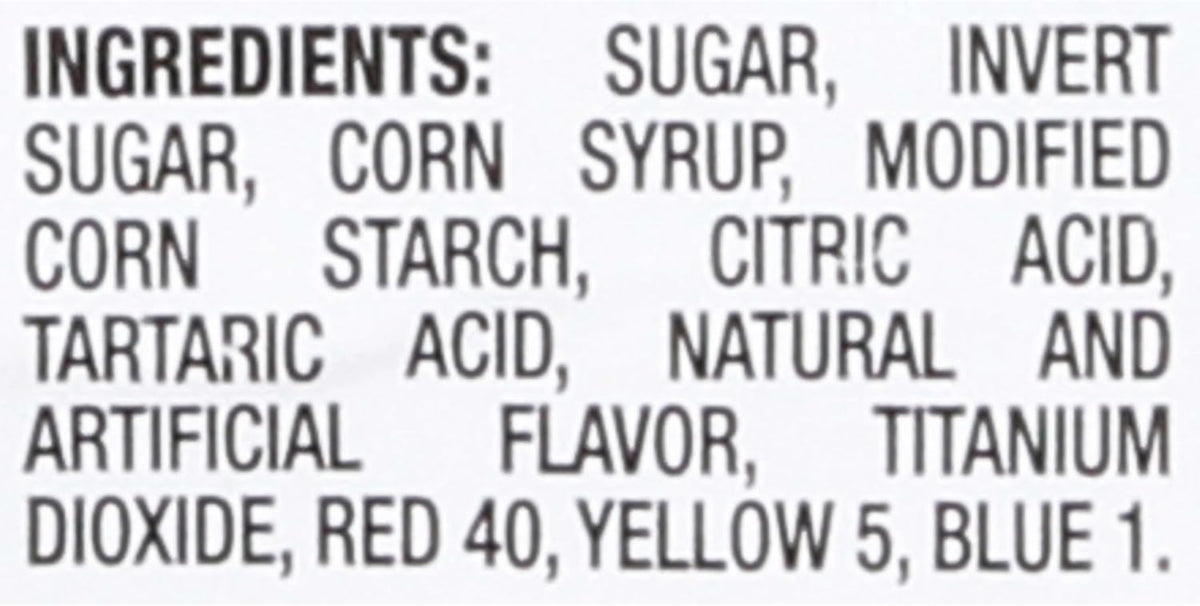 Watermelon flavored soft and chewy sour candies spread out on table
