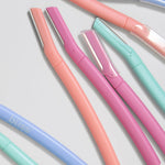 Bliss eyebrow razor and dermaplaner set packaging highlighting the eight pieces