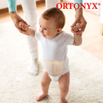 Side angle of Ortonyx infant hernia truss showing slimline profile