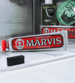 Marvis cinnamint premium toothpaste tube with sculpted silver cap close up