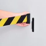 Global Industrial wall mount barrier installed in a commercial environment