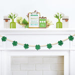 Gistome St. Patricks Day wooden beads garland front view draped on a white tiered tray.