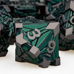 Complete 7 piece DND metal dice collection arranged on surface