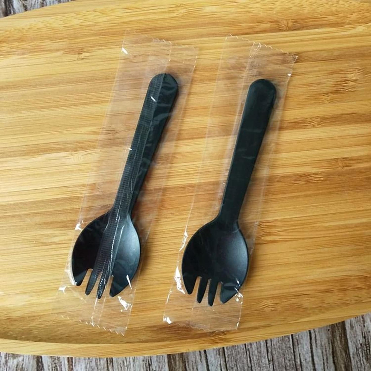 N-KONGJIAN disposable plastic sporks front view of individually wrapped black mini cutlery pack