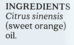 Aura Cacia sweet orange oil bottle next to fresh citrus fruit