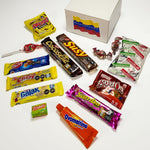 Calesbox Chucherias Venezolanas gift crate displaying assorted South American chocolates and wafers.