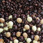 Close up view of premium Dilettante Hapsburg roasted coffee beans covered in gourmet chocolate layers.
