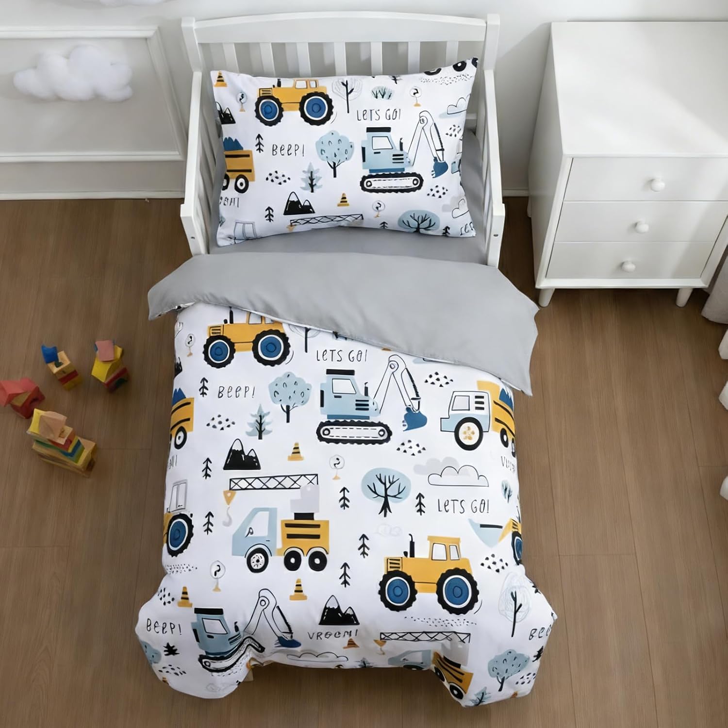 NTBED 4 piece construction toddler bedding set front view showcasing the truck comforter on a childs bed.