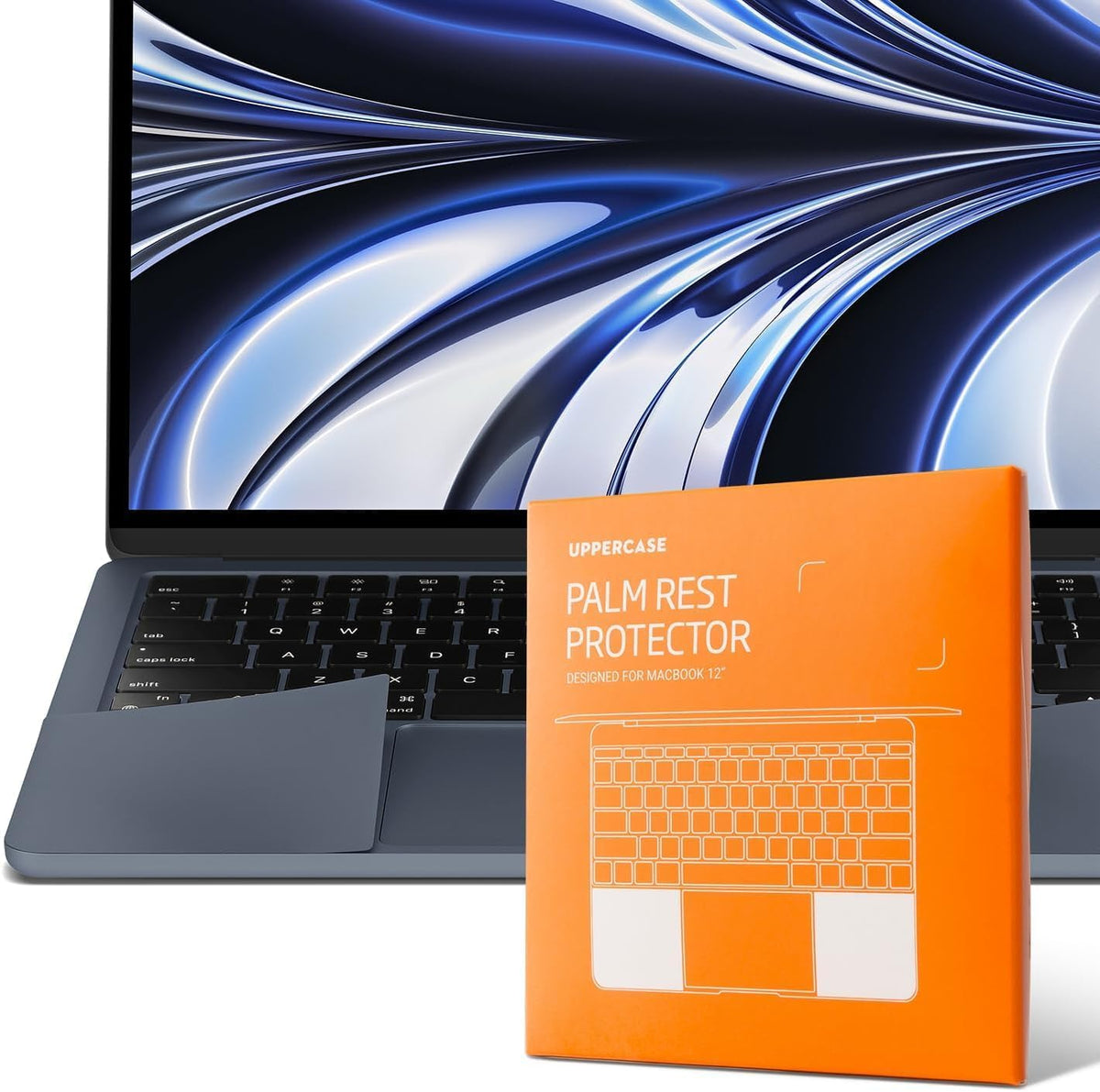 UPPERCASE GhostShield Premium Palm Rest Protector front view on a midnight MacBook Air showing complete trackpad surrounding coverage.