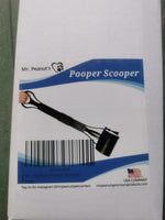 Mr. Peanut's premium imported pet waste management tool working on grass surface.