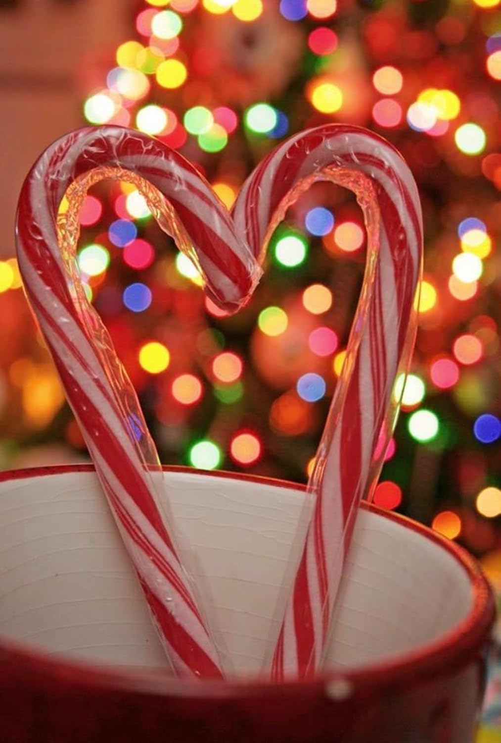 Ten boxes of MAJUU CONNECT candy canes stacked to demonstrate the bulk quantity