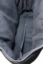 Close up of quilted fabric on Paws Pack dog bag