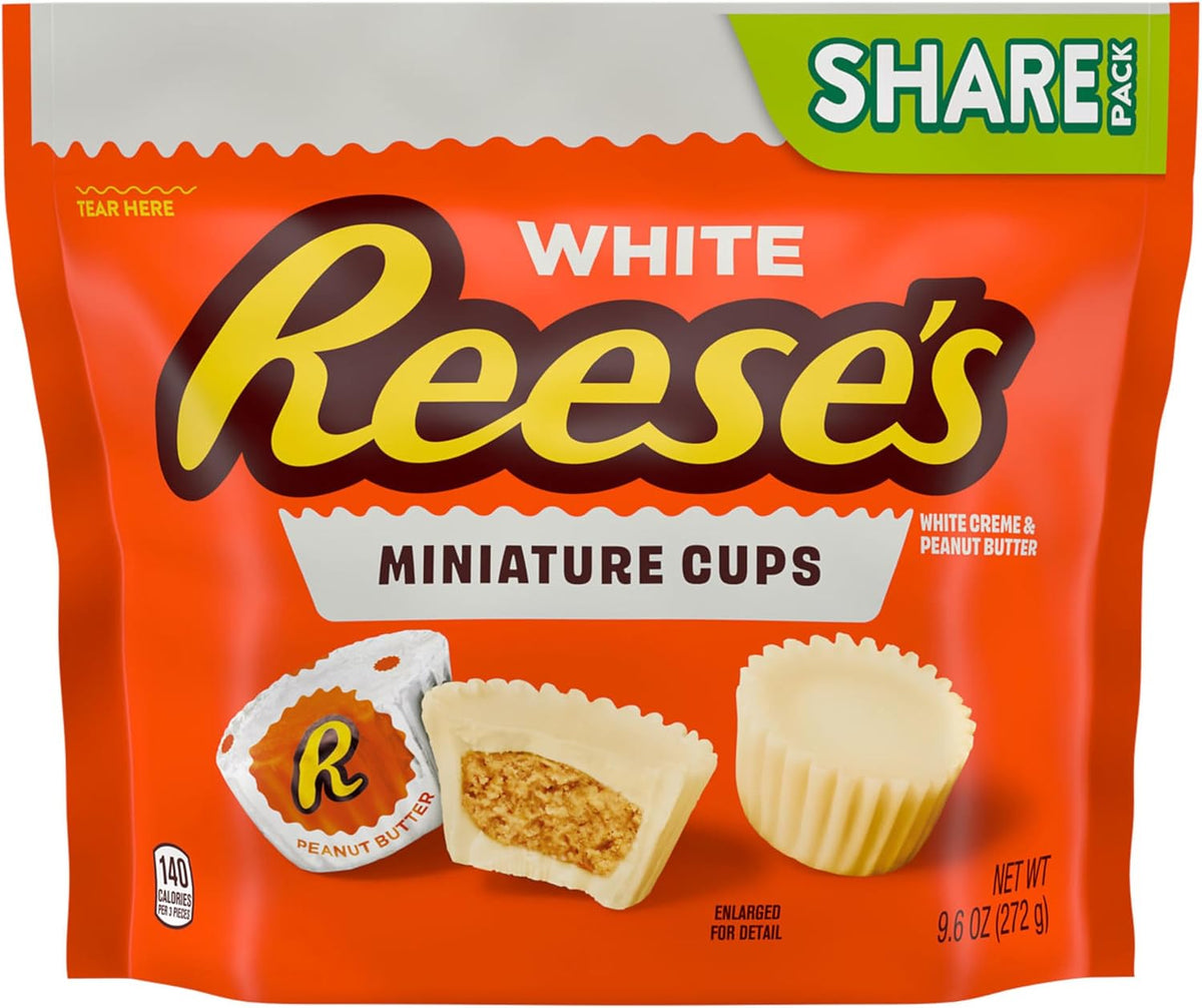 Close-up of a bite-sized white creme peanut butter cup showing the smooth outer texture.