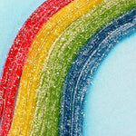 Individually wrapped two-ounce trays of sour fruit candy straws.
