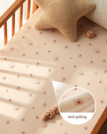 Unnivoll toddler mattress sheet stretched over corner to show deep pocket