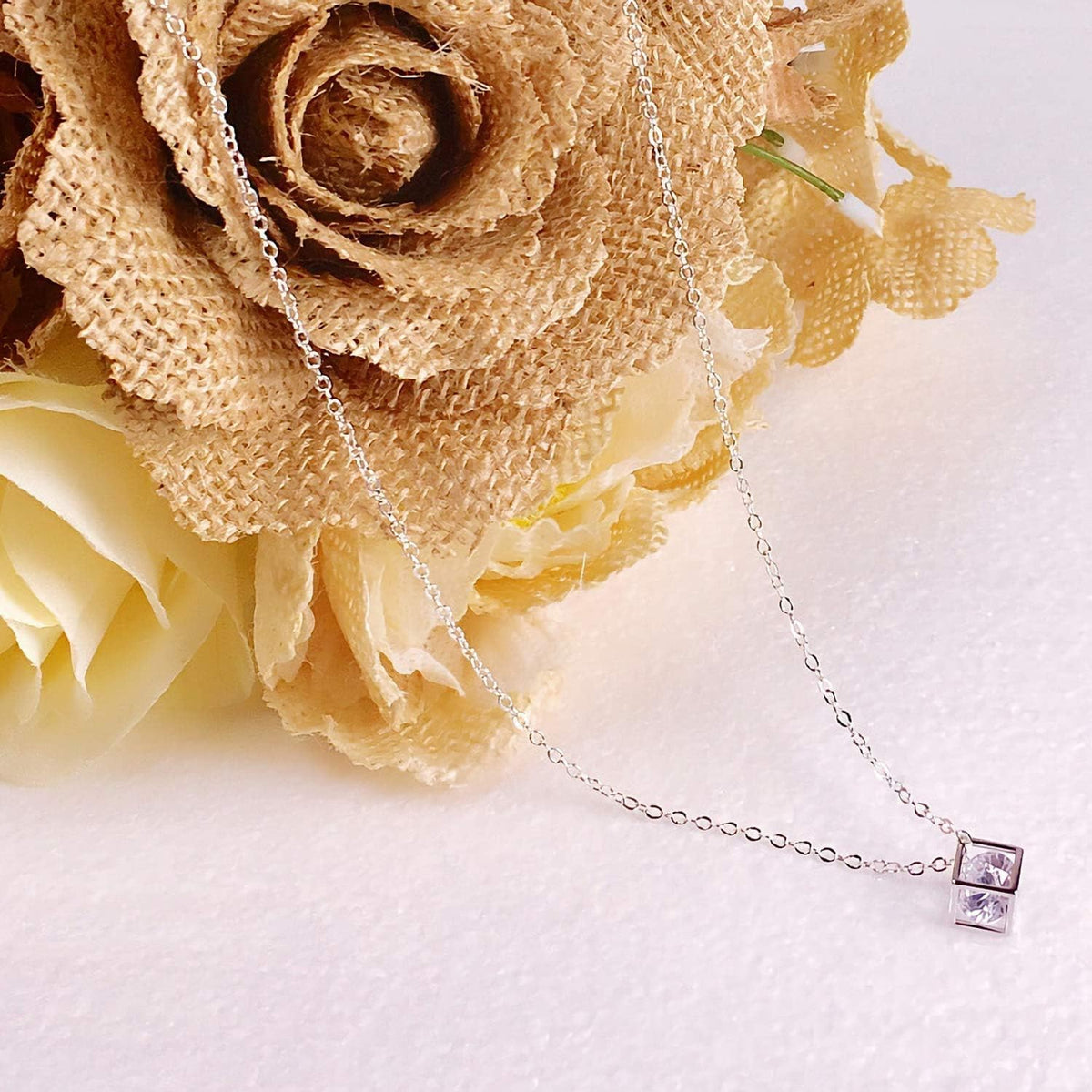 Flat lay of Sannix silver necklace chains showing length and design