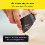 Abib Quick Sunstick Protection Bar held in hand demonstrating daily portable use.