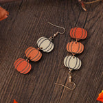 Pingyongchang double-sided wooden bat and witch earrings angled view