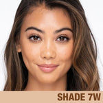 Authentic USA imported Charlotte Tilbury liquid foundation tube on a vanity counter