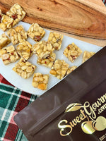 SweetGourmet premium peanut brittle candy squares showing the rich buttery texture and roasted peanuts.