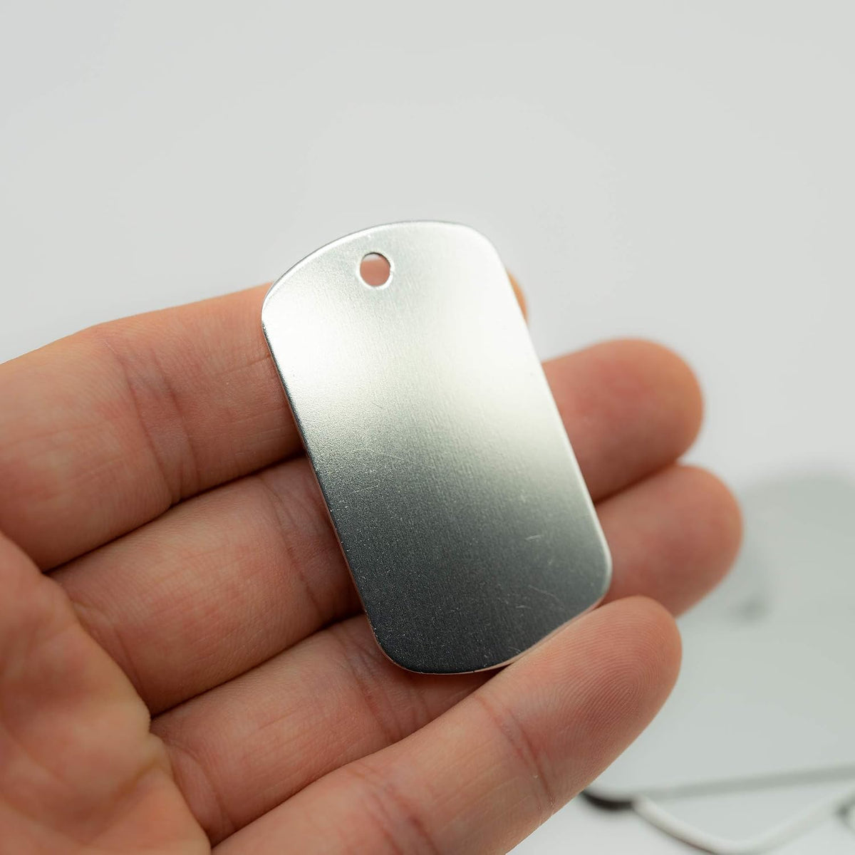 StayMax rectangular aluminum tags close up finish