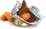 Close up view of a Hershey's Kiss chocolate cut open revealing the whole almond inside